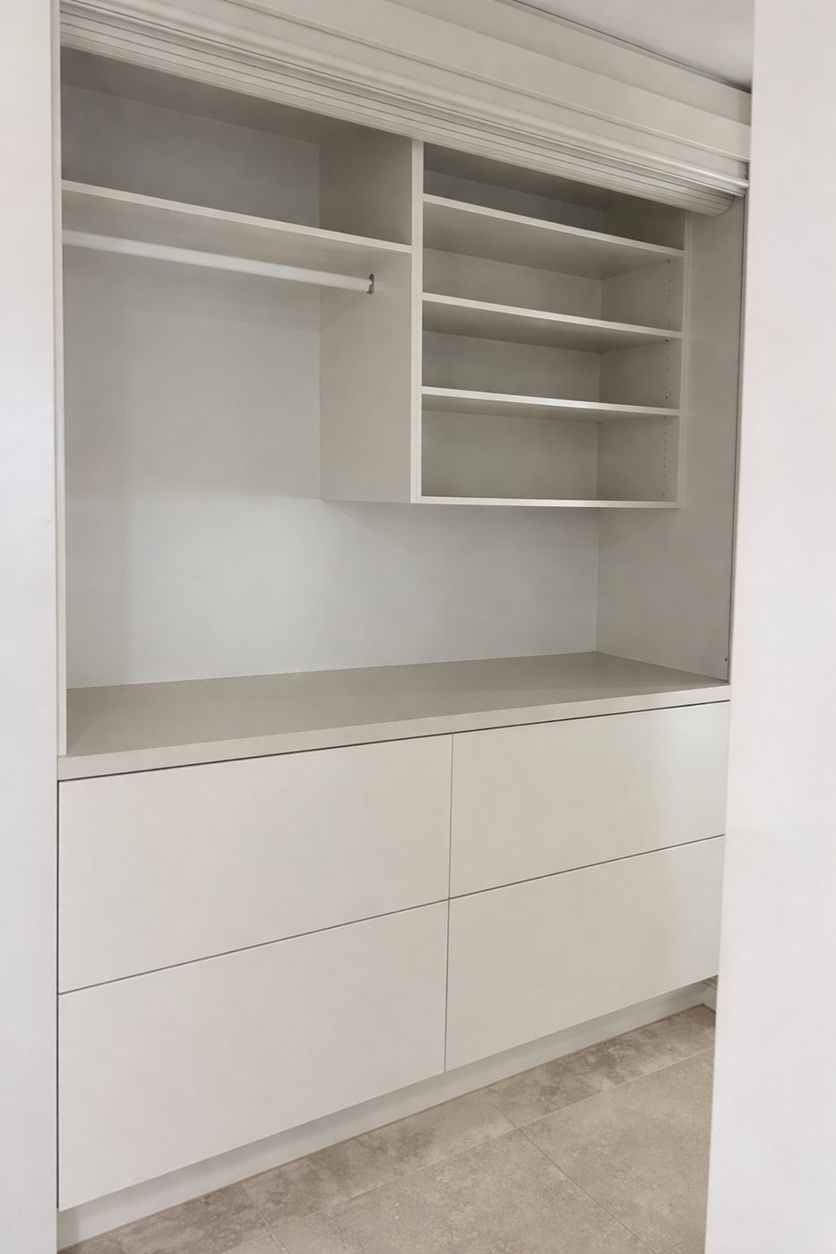 Built-in joinery with hanging space, open shelving and deep drawers